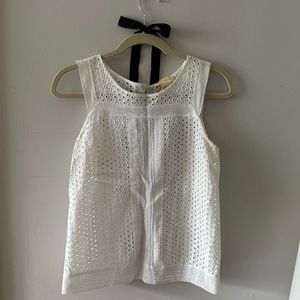 White eyelet sleeveless top.